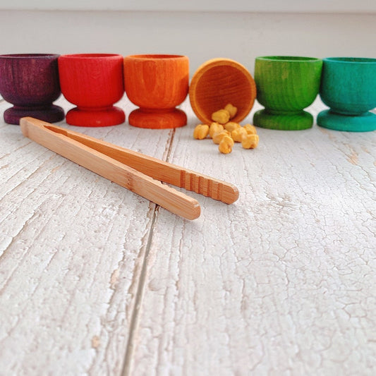 Handpainted colour sorting eggcups coloured chickpeas sensory play matching game sorting colour fine motor skills activity wooden tongs