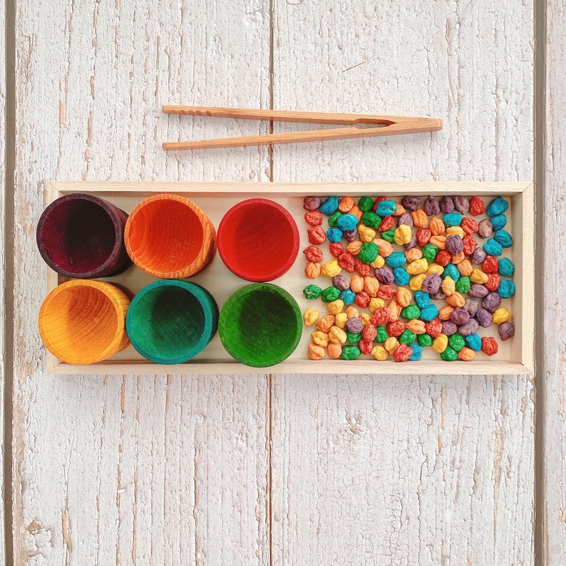 Handpainted colour sorting eggcups coloured chickpeas sensory play matching game sorting colour fine motor skills activity wooden tongs